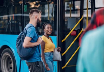 multiracial-friends-waiting-public-transportation-2023-11-27-05-24-33-utc-2